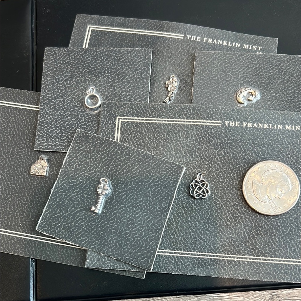 Franklin Mint Delicate Silver Charm Collection. Set of 6 charms. New in pkg.
